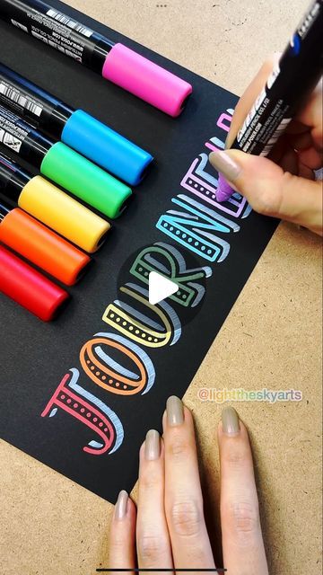 someone is doing some art with crayons and markers