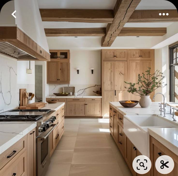 a large kitchen with wooden cabinets and white counter tops, along with an island in the middle