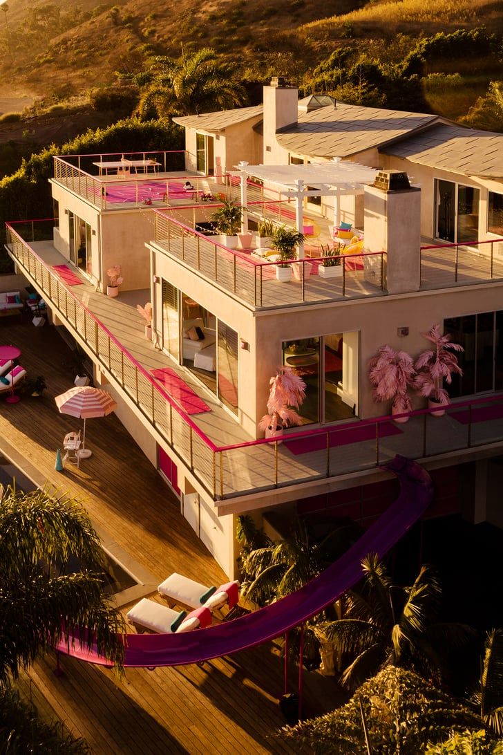 an aerial view of a house with pink decorations on the balcony and balconies