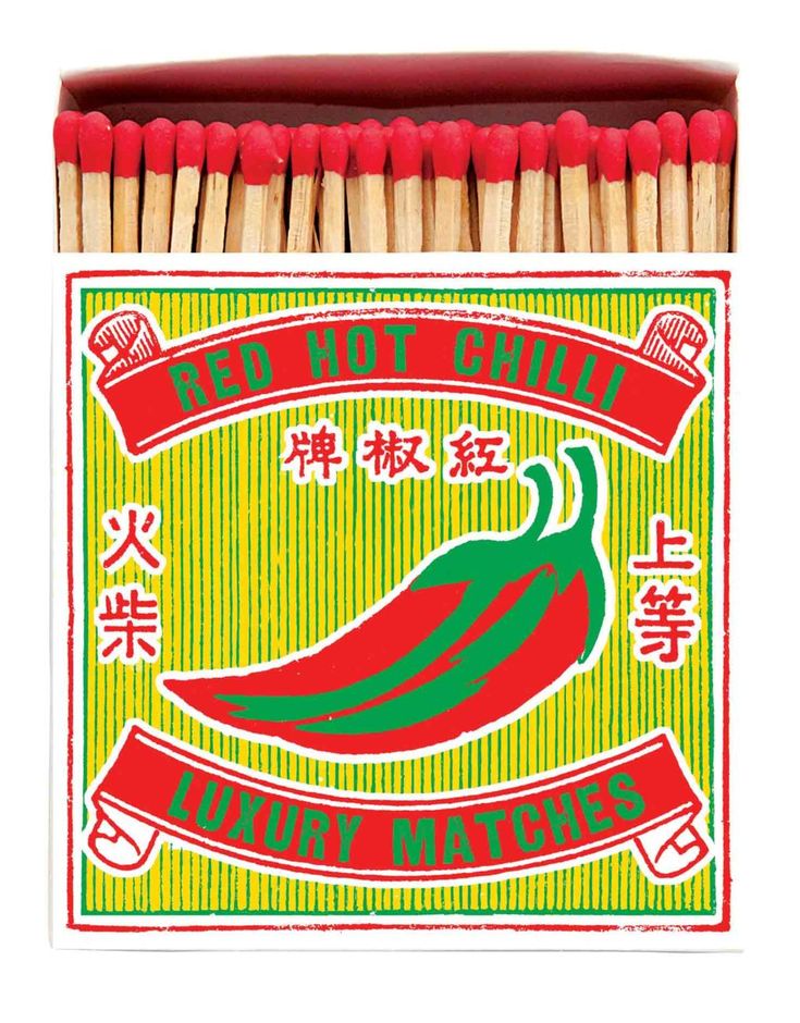 a box of matches with red and green chili peppers on it, in chinese writing