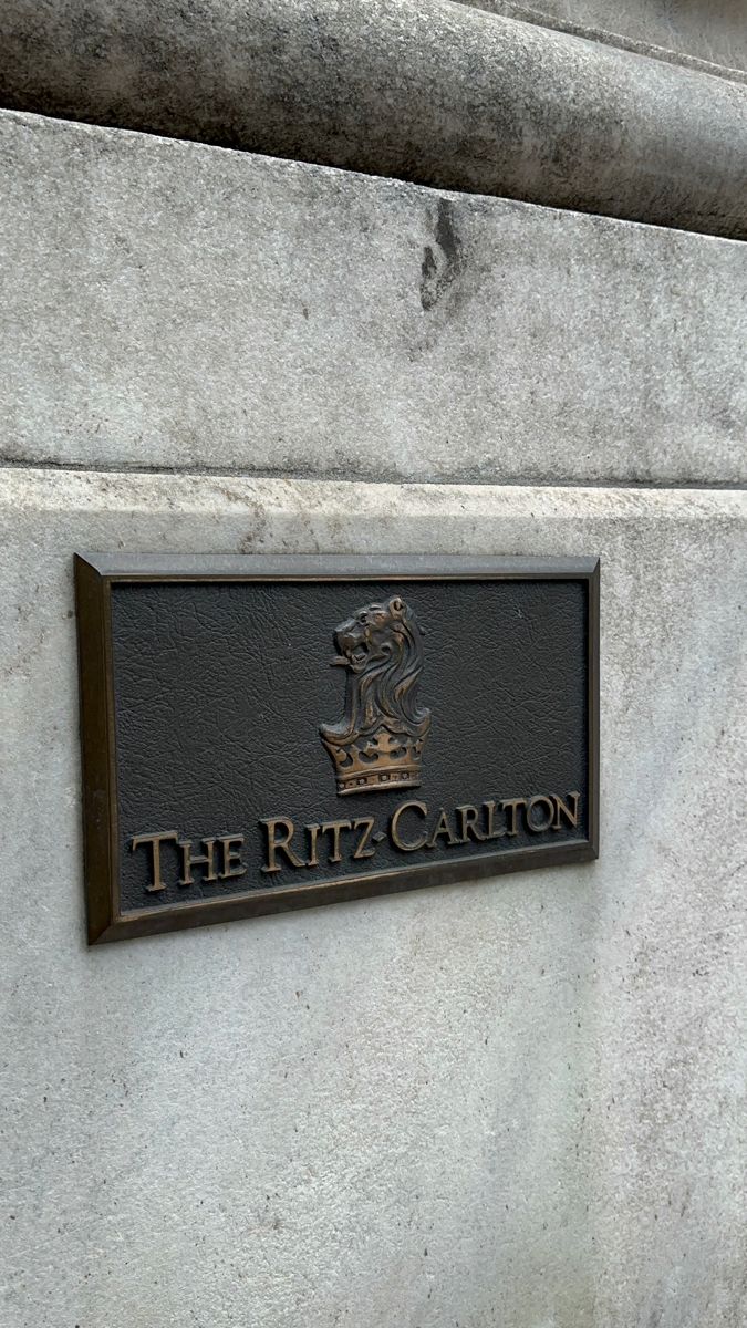 the ritz - carlton sign is on the side of a building