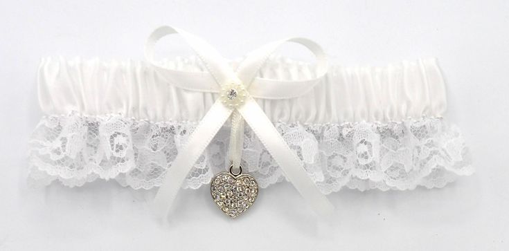 You are Viewing Brand New Stunning White Satin and Lace Garter. White Satin on Top and White Lace on Bottom, Designed with Bow, Ribbons with Silver Crystal Heart Charm.  Garter will Stretch to Approx. 21-22 Inches. Wedding Reception Party, Wedding Garters, Reception Party, Lace Garter, Silver Crystal, Garters, Blue Satin, Crystal Heart, White Satin