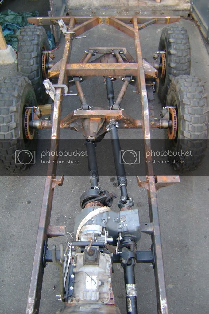 the rear end of a vehicle with two large wheels