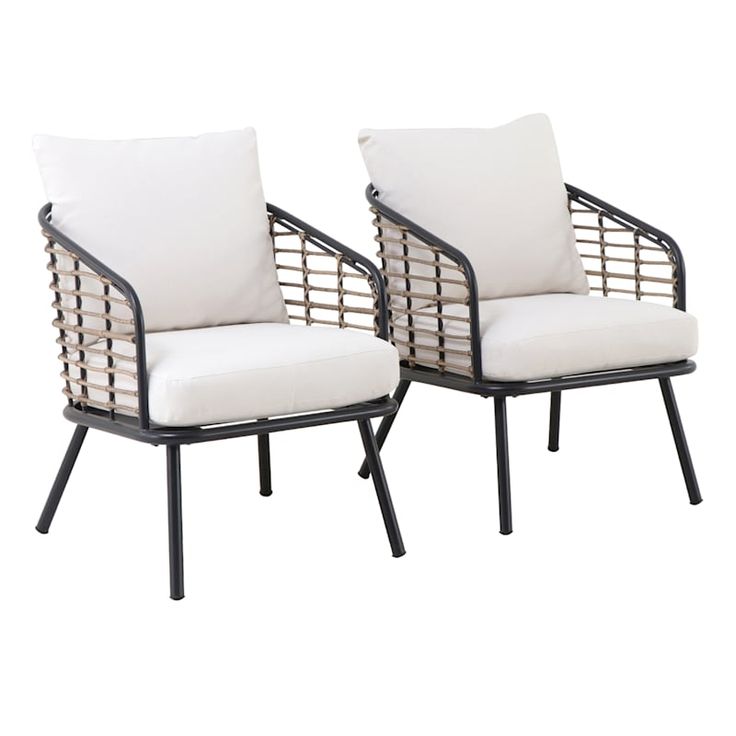 two chairs with white cushions sitting next to each other