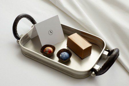 an open suitcase with some chocolates in it