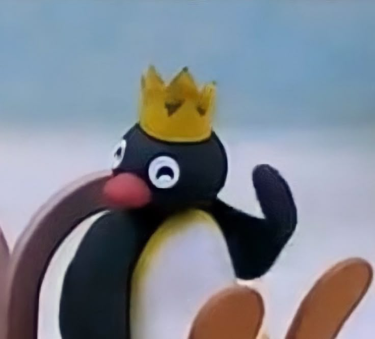 a penguin with a crown on its head