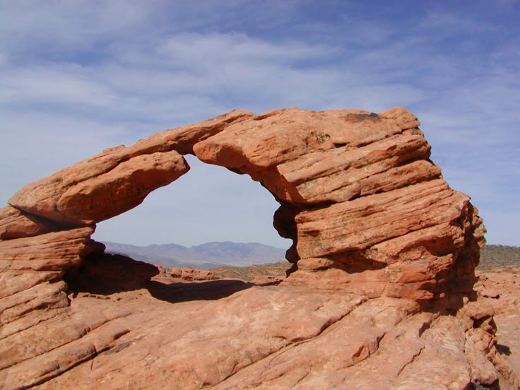 a large rock formation with a hole in the middle