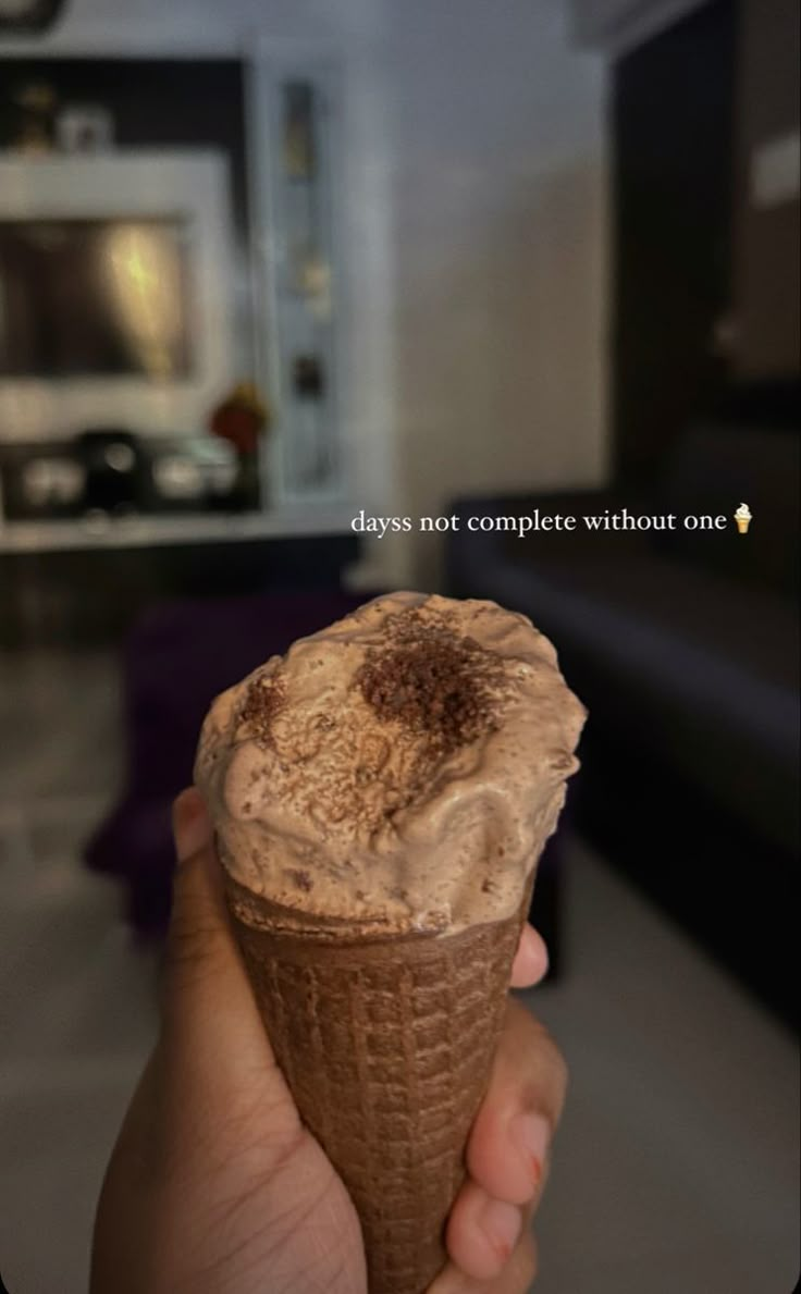 someone holding an ice cream cone in their hand with the caption says, days not complete without one