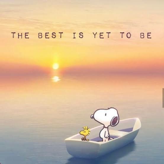 a cartoon dog in a small boat with the sun setting behind it and an inscription that reads, the best is yet to be