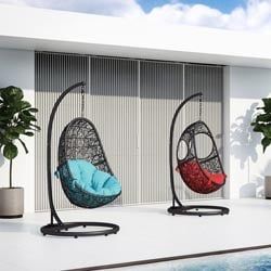 two hanging chairs next to a pool with plants in it and one on the ground