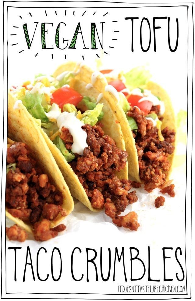 three taco crumbles with lettuce and tomatoes on top, sitting next to each other