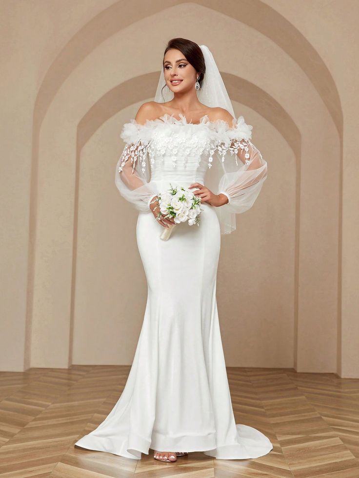 a woman in a white wedding dress holding a bouquet