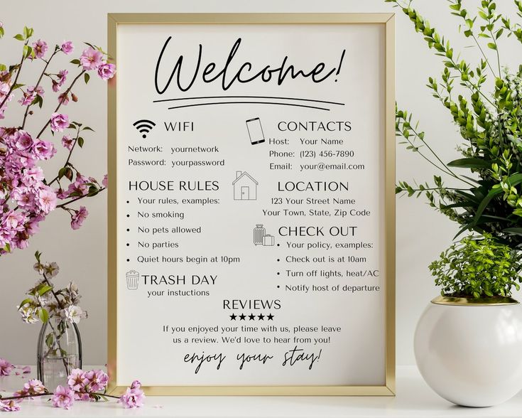 a welcome sign next to a vase with flowers