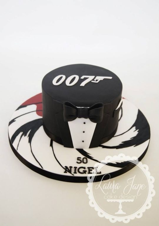 a cake with a hat and bow tie on it