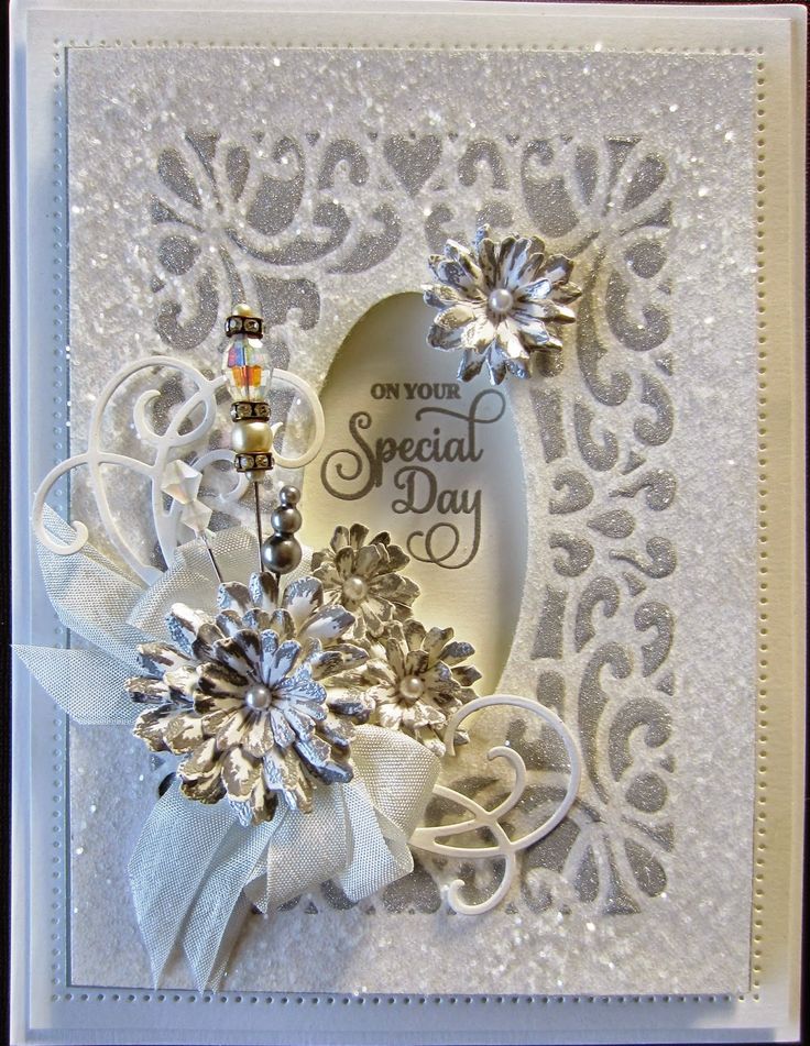 a white card with silver flowers and ribbon on it's side, which reads only you special day