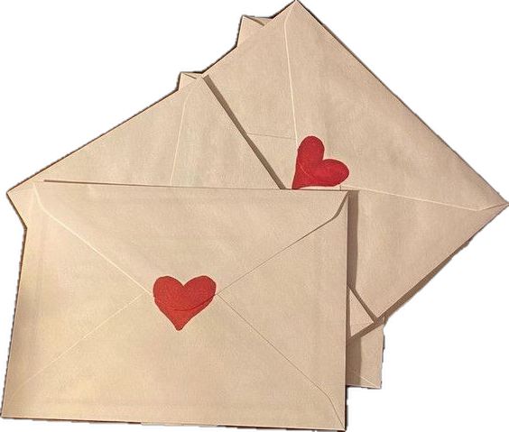 two envelopes with red hearts on them are sitting next to each other in the shape of a heart