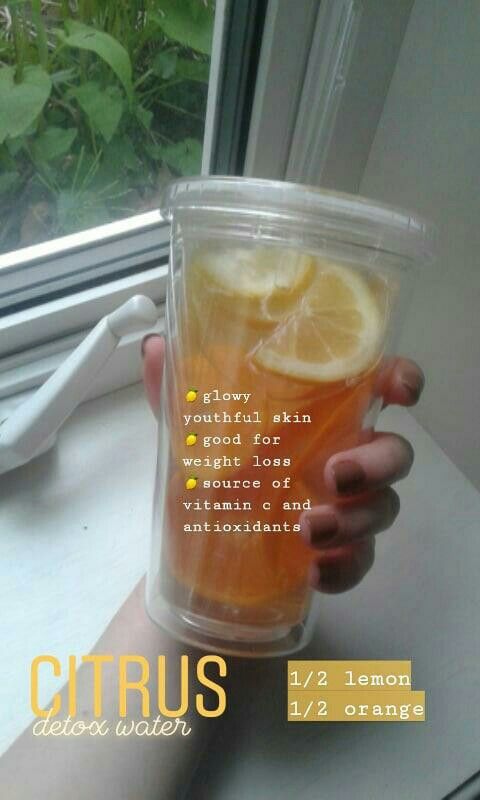 a person holding up a cup with lemons in it and the words citrus written on it