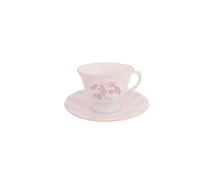 an empty cup and saucer with pink flowers on the rim, set against a white background