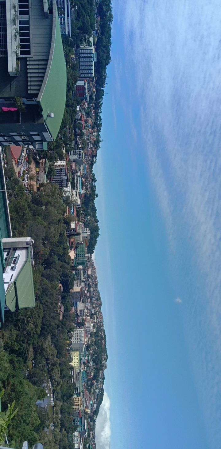 an aerial view of a city with tall buildings