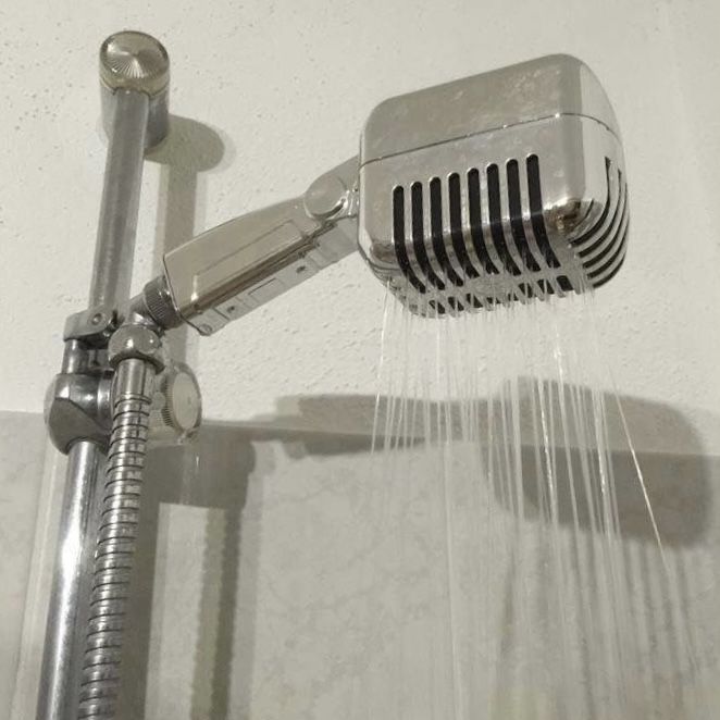 a shower head with water coming out of it