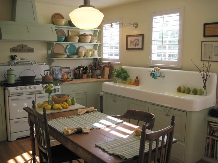 the kitchen is clean and ready to be used for cooking or baking, with plenty of natural light coming in from the windows