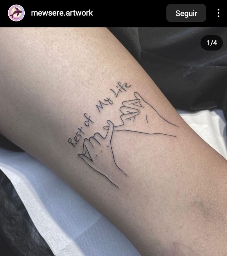 a person with a tattoo on their leg that says, i love my life and hands