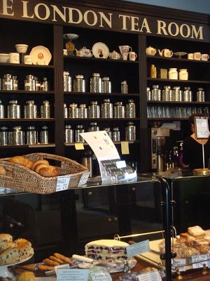 there is a tea room in london with lots of food on the counter and shelves