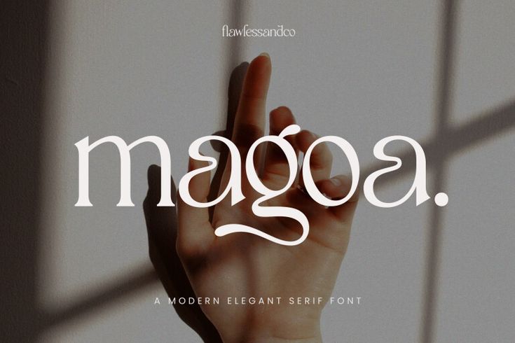 the word maggoa is written in white and has a hand up to it