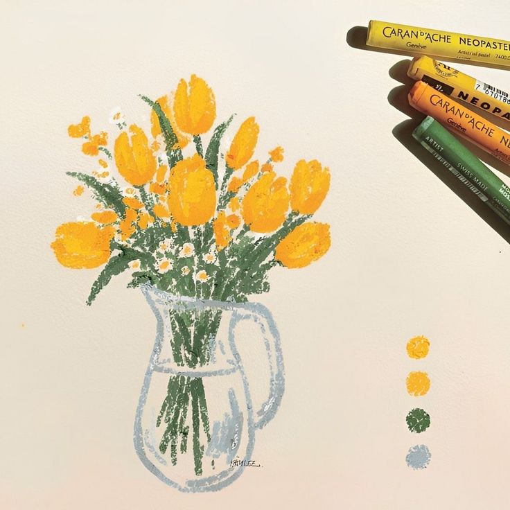 some crayons are laying next to a drawing of yellow flowers in a vase