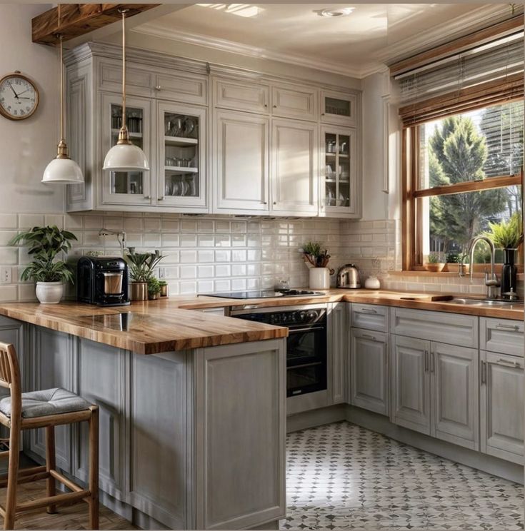 a kitchen with an oven, sink and counter top next to a clock on the wall