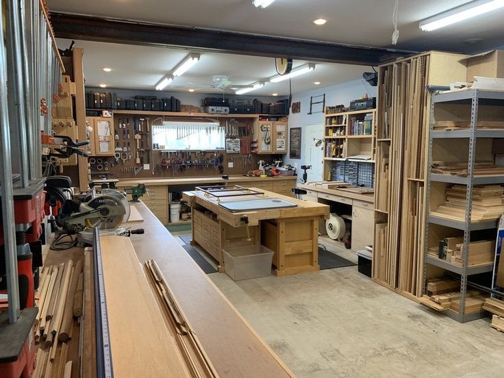 a workbench with lots of wood and tools on it's shelves in a garage