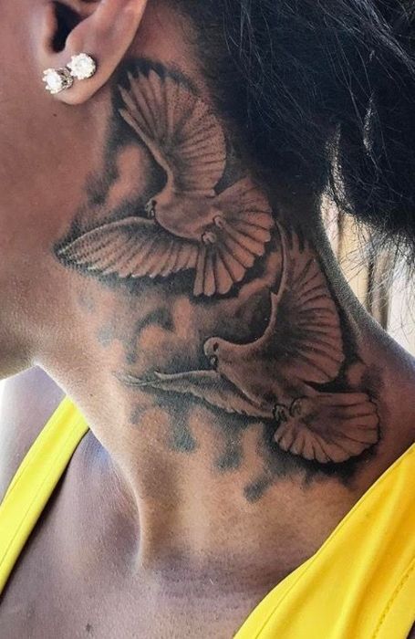 a woman with a bird tattoo on her neck