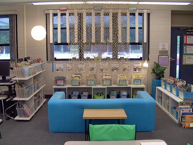 the library is clean and ready to be used as a children's playroom