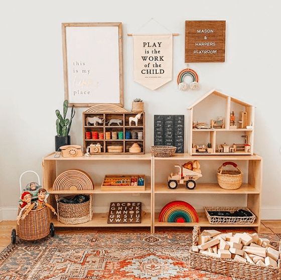 a play room with toys and books on the shelves, including an animal toy house