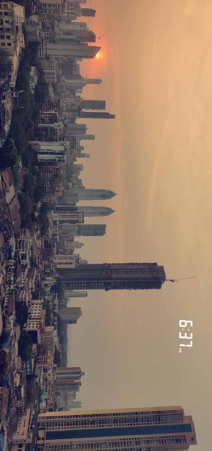 an aerial view of a city with tall buildings