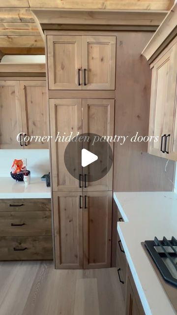 a kitchen with wooden cabinets and white counter tops