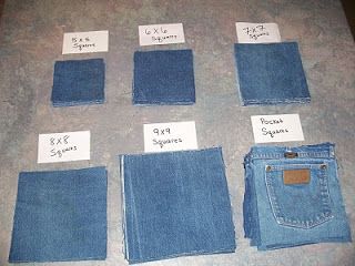 six pairs of jeans laid out on a table with labels and tags attached to them