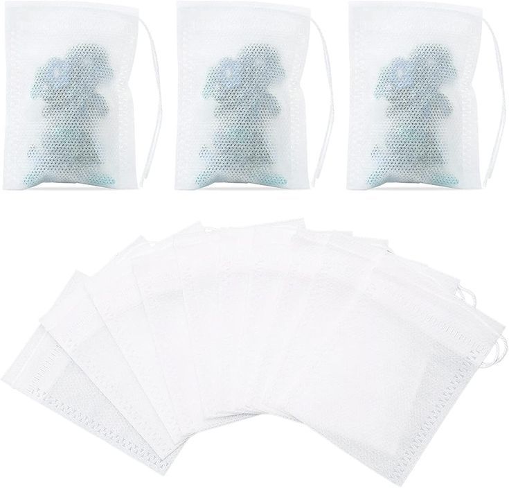 five bags with white mesh draws and one bag has a blue teddy bear on it