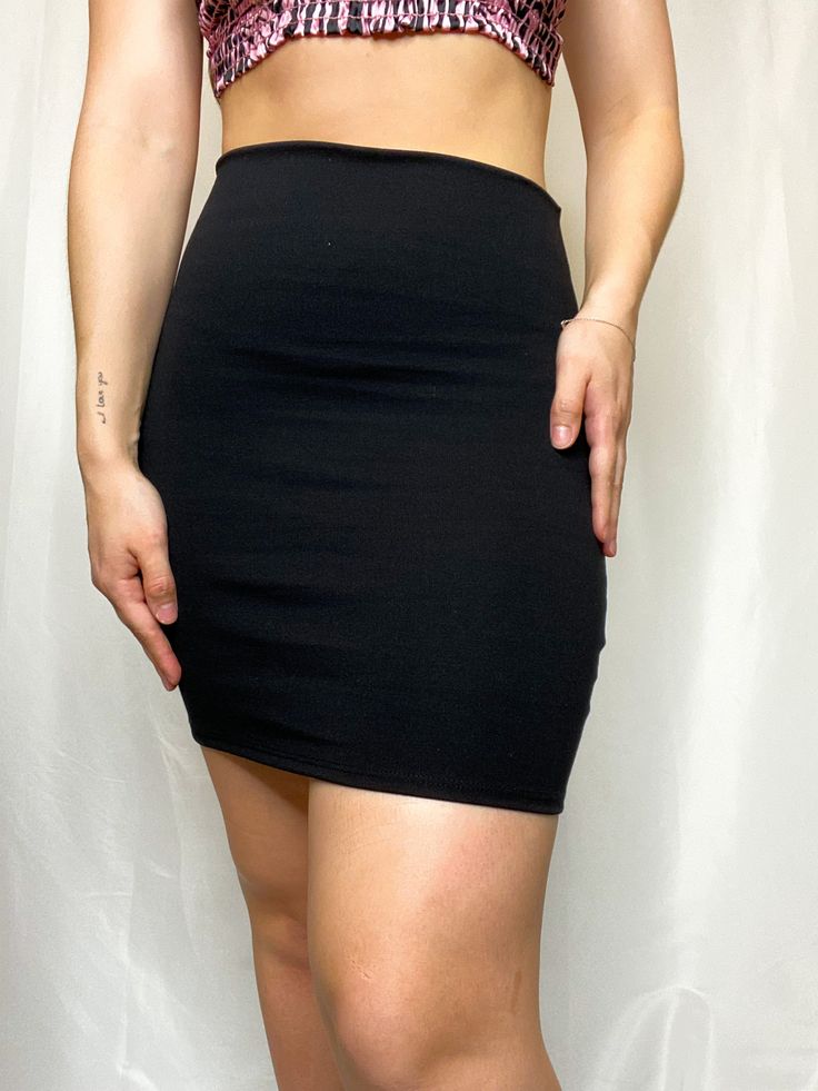 No matter the vibe, the Simple Joys Black Bodycon High Waisted Skirt knows how to show you off! Medium-weight woven fabric shapes this high-rise silhouette and figure-hugging design. This skirt will go with any type of top, giving you unlimited options! 73% nylon, 24% rayon, 3% spandex Hand wash cold, hang to dry Runs small, we recommend sizing up Unlined Model Information: Height: 5'6" Bust: 32" Waist: 28" Hips: 40" Wearing: Large Cotton Mini Skirt For Night Out, High Waist Stretch Lined Skirt, Fitted High Waist Solid Skirt, High Waist Fitted Solid Color Skirt, Fitted High Waist Solid Color Skirt, Fitted Elastane Mini Skirt In Solid Color, Solid Color Fitted Mini Skirt, High Waist Cotton Mini Skirt For Night Out, Black Bodycon Casual Skirt