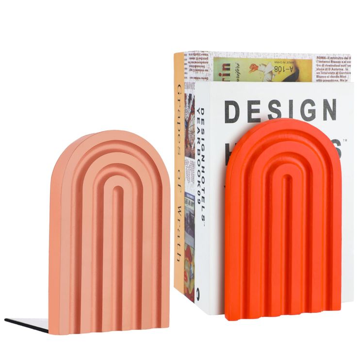 an orange and white object next to a cardboard box with the word design printed on it