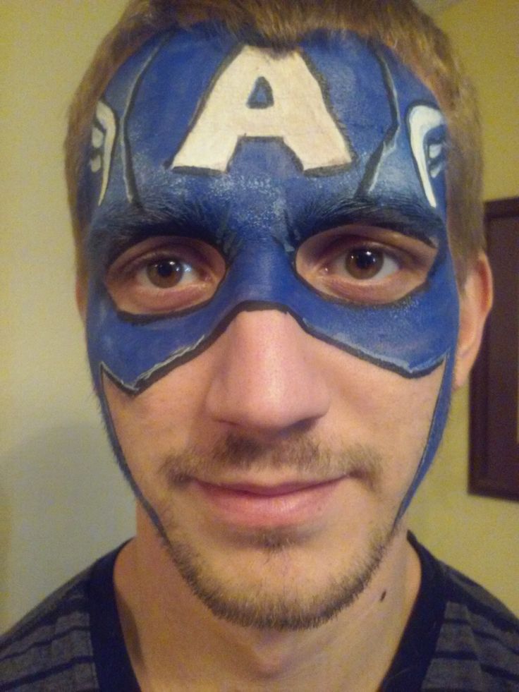 a man wearing a captain america mask with his face painted to look like the letter a