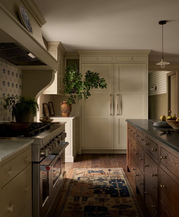 a kitchen with an oven, stove and sink in it's center island area