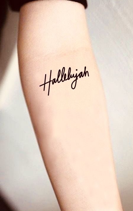 a person with a tattoo on their arm that says,'helllyjah '