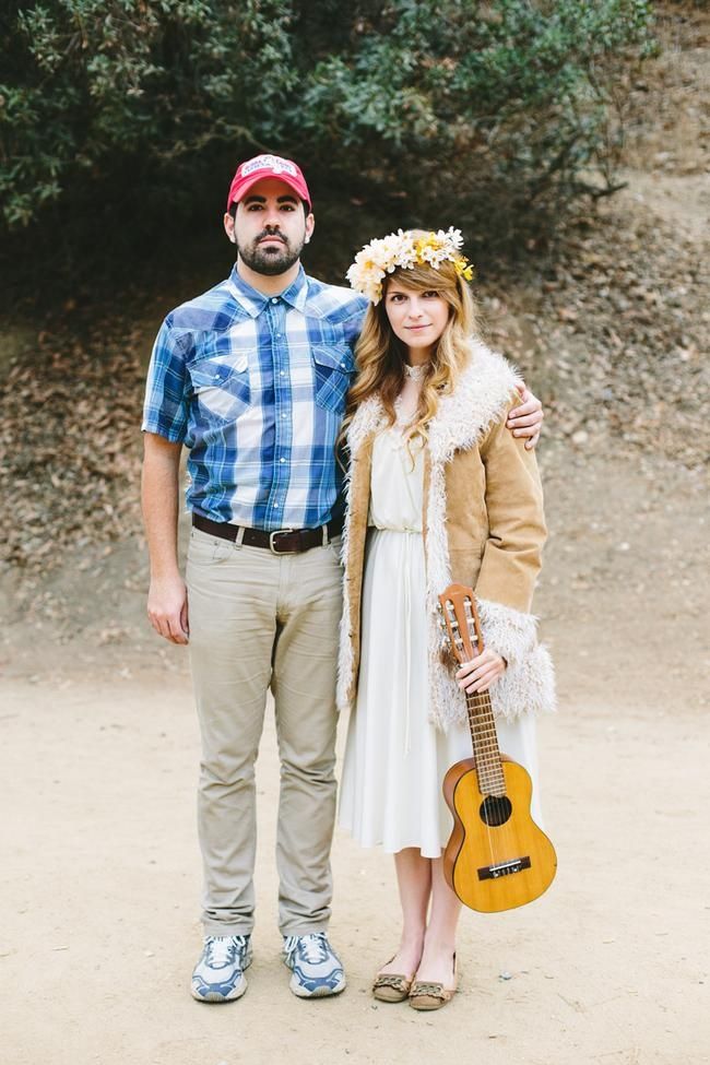 a man and woman standing next to each other holding an ukulele guitar in their hands