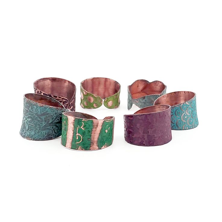 Rustic patina copper rings available in six artisan patina colors. Boho cuff style rings. Note: the patina is unique on every ring and may be slightly different than the photo. Ring is treated with a colorful patina with artisan pigments. Each piece that one-of-a-kind weathered patina. Rings are 100% copper & are nickel & lead-free. Adjustable to fit most average finger sizes. For proper care & to preserve the beautiful patina finish, it's best not to immerse in water. -------------------------- Handmade Copper Artisan Ring, Adjustable Multicolor Patina Jewelry, Unique Green Copper Ring, Unique Green Copper Rings, Artisan Rings With Patina And Adjustable Fit, Green Copper Rings As Gifts, Patina Jewelry, Jewelry Rustic, Patina Copper