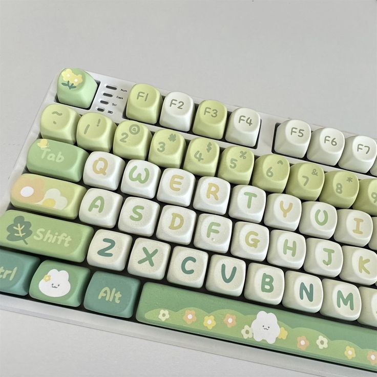 a green and white keyboard sitting on top of a table