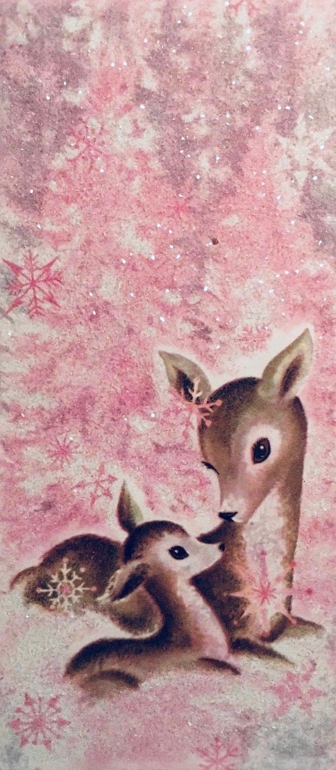 two baby deers are sitting next to each other on a pink and white background