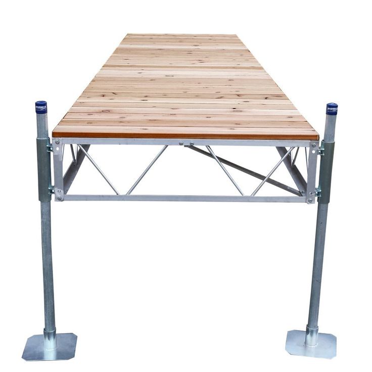 a wooden table sitting on top of two metal legs with one leg raised to the side