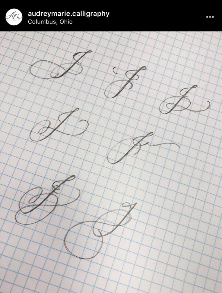 some type of calligraphy on a sheet of paper