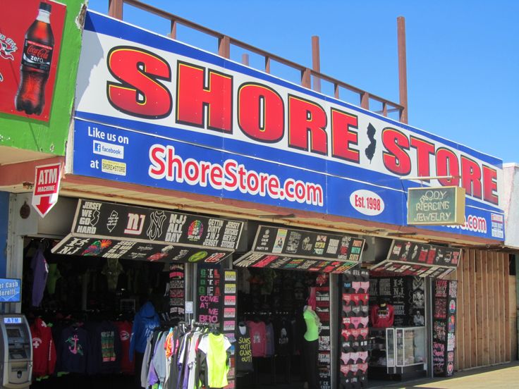 a store front with clothes on display outside